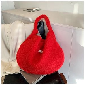 Detail of red faux fur hobo tote bag showing soft plush texture and spacious interior