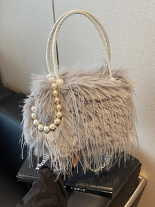 Chic leopard print faux fur bucket bag with pearl handle and gold chain strap