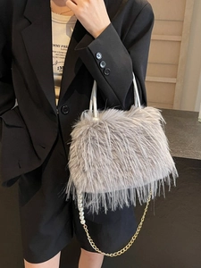 Elegant light gray faux fur bucket bag with pearl chain strap and soft plush texture