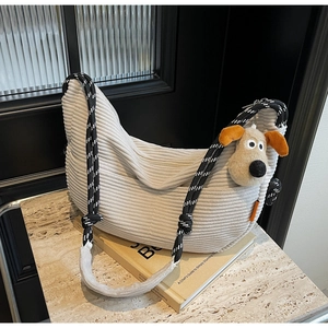 Corduroy crescent shoulder bag with woven rope strap and cute plush puppy keychain