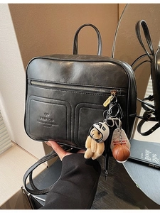 Fashionable black matte synthetic leather backpack with large capacity and cute bear charm