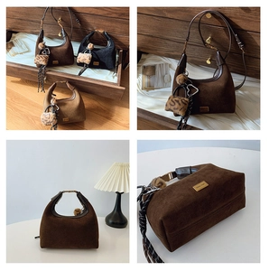 Detail of matte suede dumpling bag with leopard charm and plush ball accessory