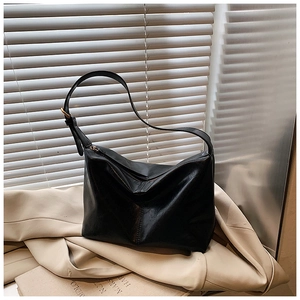 Detailed view of large black retro tote bag with zipper closure and stitching on soft leather