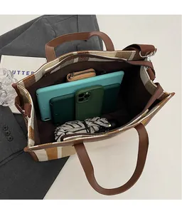 Detailed top view of a large canvas tote bag interior showing spacious capacity and pockets