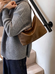 Brown leather hobo tote bag for women with vertical stitching, minimalist vintage style
