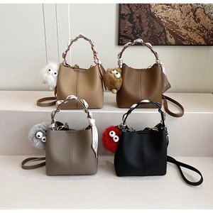 Litchi pattern bucket bags with silk scarf handles and plush charms in 4 colors