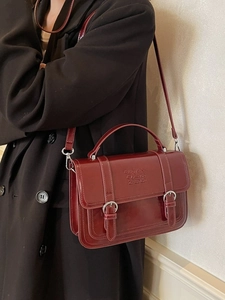Vintage burgundy leather messenger bag with top handle and adjustable shoulder strap