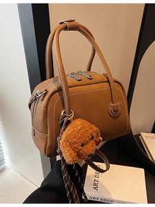 Retro brown lychee leather Boston bag with contrast stitching and cute puppy charm