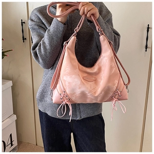 Detailed view of pink marble texture tote bag with side drawstring and versatile straps