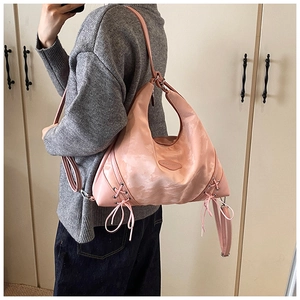 Pink large-capacity hobo bag with side ribbon bow details and satin finish