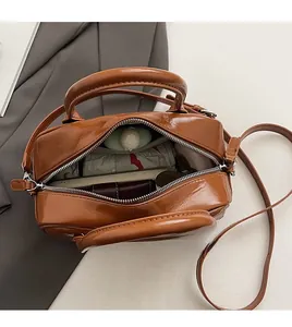 Interior view of vintage brown bag showing large capacity with umbrella and wallet