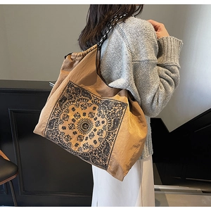 Detail of bohemian tote bag featuring ethnic patterns and jacquard woven strap