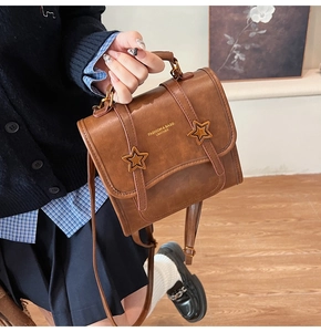 Brown vintage leather handbag with star buckles and fashion print in college style