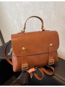 Vintage brown leather backpack for women with multifunctional straps and top handle
