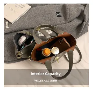Macro view of matte leather bucket bag interior showing spacious capacity for essentials