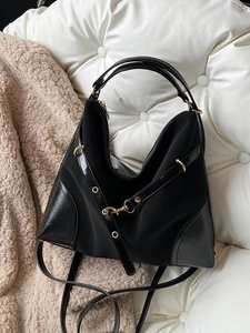 Large capacity black nylon handbag with gold rings and faux leather trim accents