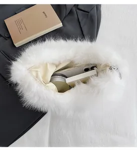 Detailed internal view of spacious white faux fur shoulder bag with satin lining