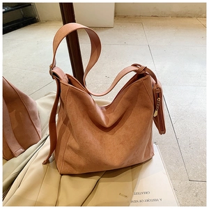 Detail of light pink frosted leather tote bag with a matching small coin purse