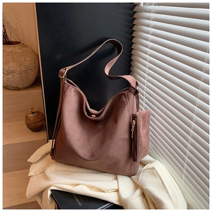 Detail of matte retro brown tote bag with magnetic clasp and matching mini zipper pouch