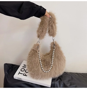 Detailed view of khaki faux fur shoulder bag with silver chunky metal bead chain