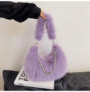 Detail of purple faux fur hobo bag with silver beaded chain and plush handle
