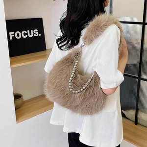 Detail of brown faux fur hobo bag with silver beaded chain and adjustable shoulder strap