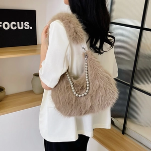 Plush faux fur hobo bag in light brown with decorative silver bead chain shoulder strap