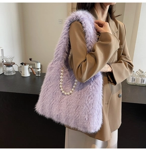 Detail of lavender plush tote bag with elegant pearl chain and soft faux fur texture