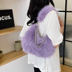 Detailed shot of lavender faux fur texture and silver beaded chain strap on shoulder bag