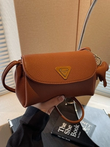 Retro brown lychee pattern leather shoulder bag with gold metal logo and dog charm