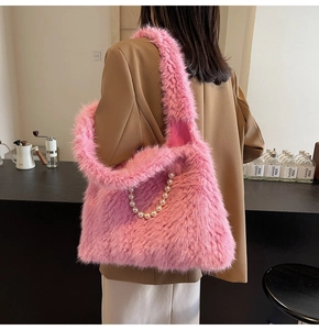 Detail of pink faux fur tote bag showing plush texture and decorative pearl chain strap