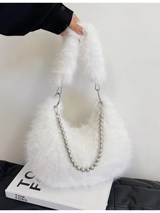 Chic white faux fur shoulder bag with elegant metal bead chain and fluffy handle