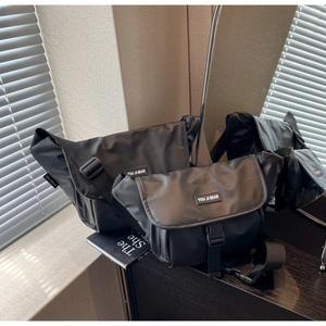 Waterproof black crossbody messenger bags in two sizes with wide adjustable straps