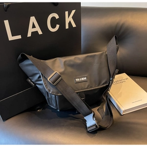 Detail of waterproof messenger bag with adjustable shoulder strap and secure buckle