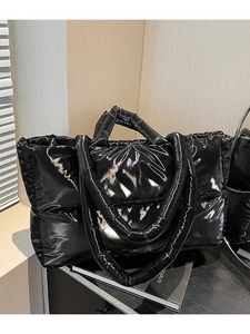 Glossy black quilted puffer tote bag with wide handles and a large capacity design