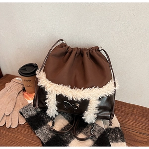 Deep brown autumn drawstring bag with white faux fur trim and silver butterfly detail