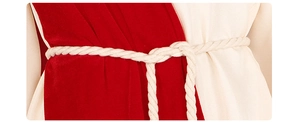 Detail of red velvet and beige fabric medieval tunic with a white braided rope belt