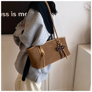 Brown frosted tote bag with fashion lettering and checkered bow charm accessory