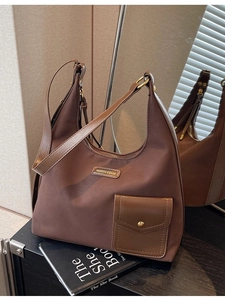 Brown large capacity hobo bag with leather pocket and adjustable shoulder strap