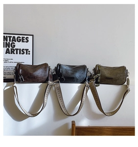 Trio of vintage textured pillow bags in brown, black and olive with wide woven straps