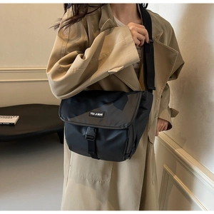 Detail of waterproof crossbody bag with large flap closure and heavy-duty plastic buckle