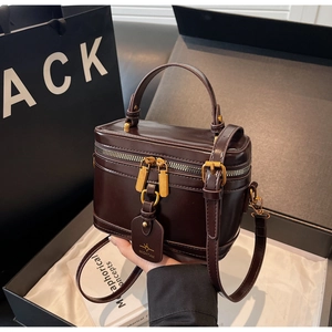 Exquisite burgundy vanity box bag with gold hardware and logo tag in a luxury gift set