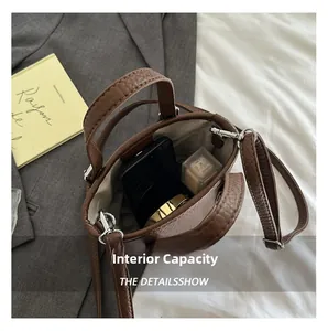 Top view of brown lychee leather bucket bag showing internal capacity for phone and makeup