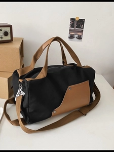 Retro canvas travel tote bag in black and brown with adjustable shoulder strap