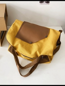 Versatile bright yellow canvas backpack and messenger bag with brown leather flap
