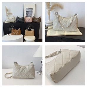 Detail of quilted leather underarm bag with metal chain strap in various elegant colors