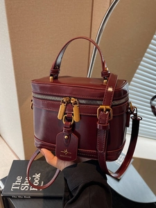 Elegant burgundy box bag with top handle and adjustable strap for women in high quality