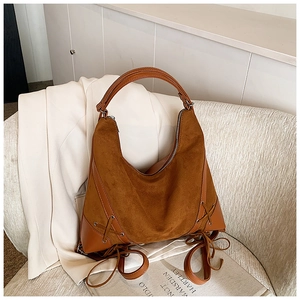 Detailed view of the brown matte suede large hobo bag with vintage ribbon bow design