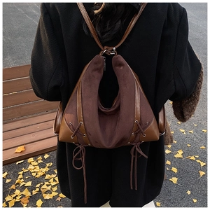 Dark brown retro backpack featuring frosted texture and unique side drawstring details