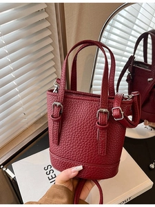 Elegant wine red lychee leather mini bucket bag with top handles and adjustable strap